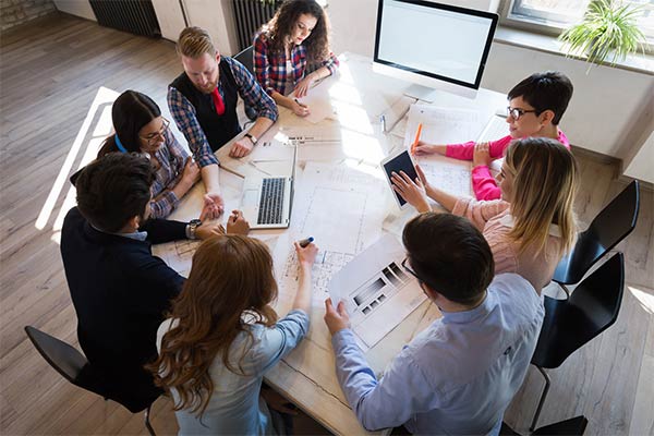 group of employees around a table