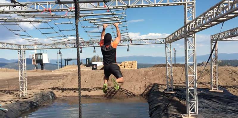 man undertaking an assault course