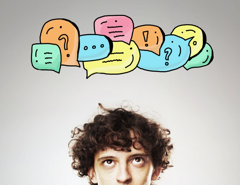man with multiple thought bubbles above his head