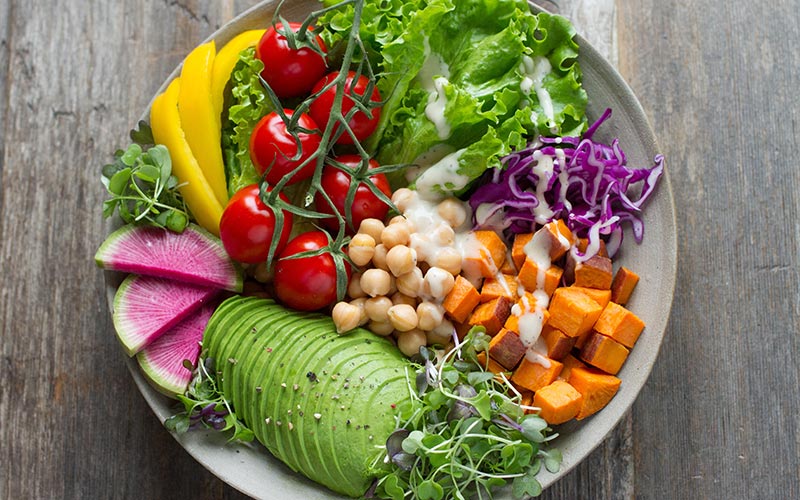 a bowl of healthy colourful salad food